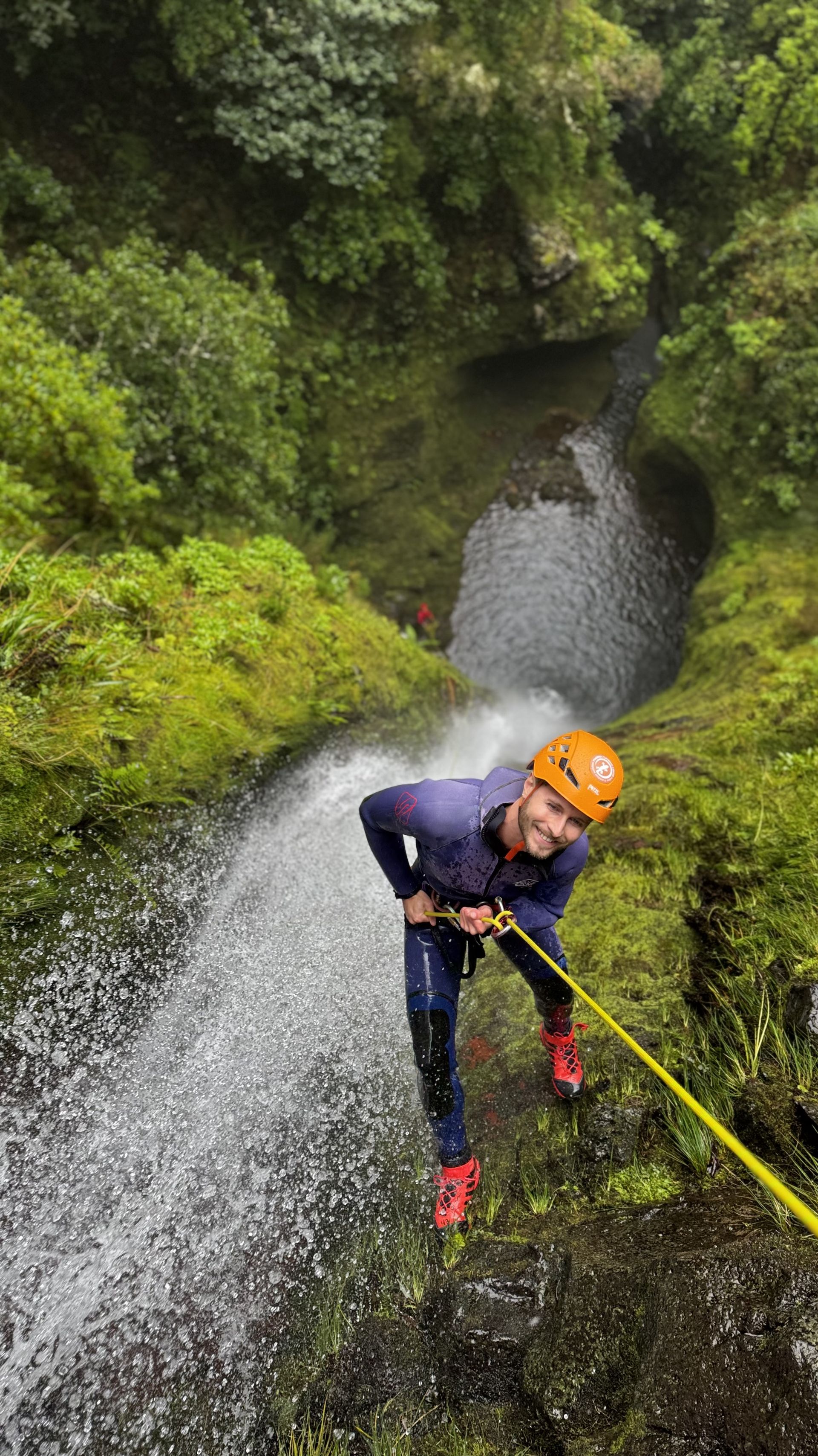 Jumping into natural pool during canyoning tour in Madeira