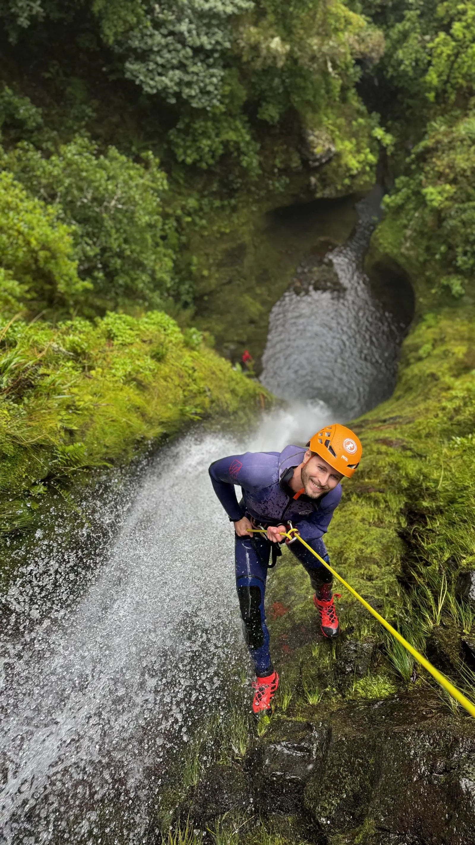 Jumping into natural pool during canyoning tour in Madeira