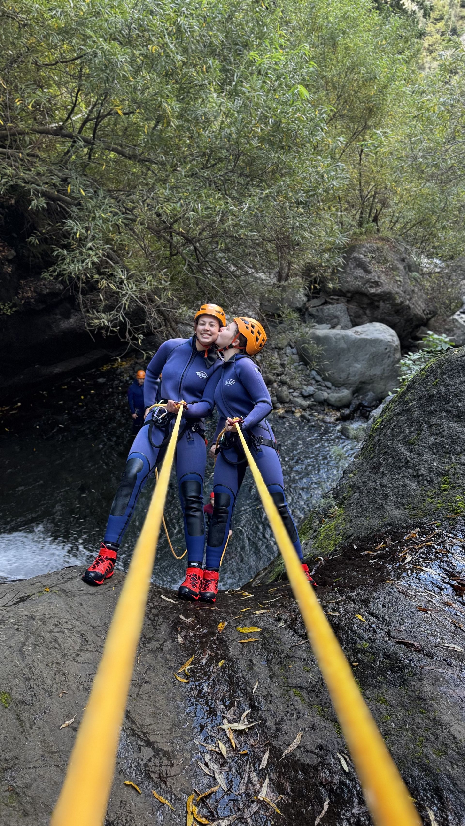 Guided canyoning group exploring Madeira waterfalls